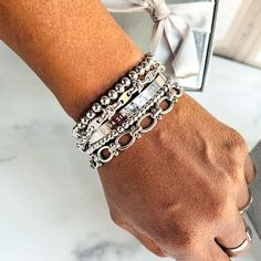 Give yourself options with the Chrisette Bracelet Stack. This bracelet stack features five dainty bracelets that are designed to mix and match for an assortment of styles. Wear just one, two or three - or stack them all for an extra pop! This braclet stack includes:- Nakia stainless steel beaded bracelet (4mm and 6mm)- Jada stainlesss steel bracelet- Lily stainless steel bracelet - Darla stainless steel bracelet Select option with Watch Band to also include the Bella Apple Watch Band (Apple watc Stainless Steel Bracelets, Silver Stacking Bracelets, How To Stack Bracelets, Tiffany Bracelet Stack, Bracelet Stack Ideas, Watch Stack, Bracelets Stacking, Stack Jewelry, Chunky Silver Jewellery