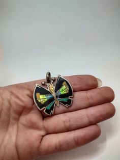 Vintage beautiful colorful sterling silver butterfly pendant decorated withcolorful enamel Signed 925 for silver and market Mark(bit deleated by time) Size 34x40 mm Weight 9.62 g All of our pieces are in pre-loved, vintage or antique condition, with signs of age and wear preserved as a mark of authenticity. Unique Butterfly Charm Pendant Jewelry, Silver Pendant With Black Enamel, Unique Sterling Silver Jewelry With Butterfly Charm, Silver Necklace With Black Enamel In Distinctive Style, Unique Jewelry With Butterfly Charm For Gift, Unique Butterfly Charm Jewelry For Gift, Multicolor Enamel Jewelry With Large Pendant, Multicolor Enamel Jewelry With Black Details, Collectible Nickel-free Enamel Jewelry