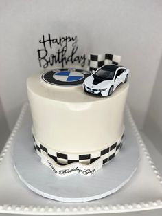 a birthday cake with a car on top