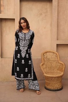 Floral Black Chikankari set, Chikankari Kurta Pant Set, Handmade Lucknowi Chikankari Kurti Casual Wear, Minimal look Kurta boho Fashion Introducing our stunning Black and White Chikankari Kurti and Palazzo Set--a captivating ensemble that seamlessly marries the classic elegance of monochrome with the intricate craftsmanship of Chikankari embroidery. Elevate your ethnic wardrobe with this timeless creation that exudes sophistication and charm for any occasion. Immerse yourself in the artistry of Chikankari embroidery, where skilled artisans have handcrafted every inch of this set with precision and care. The white Chikankari work intricately adorns the black canvas, creating a mesmerizing contrast that is both bold and graceful. The black and white color combination is a timeless choice, of Bohemian Palazzo Set With Resham Embroidery, Bohemian Long-sleeve Palazzo Set For Festivals, Bohemian Long Sleeve Palazzo Set For Festivals, Bohemian Long Sleeve Palazzo Set For Eid, Bohemian Long Sleeve Palazzo Set For Festive Occasions, Festive Long Sleeve Bohemian Palazzo Set, Bohemian Block Print Sharara For Eid, Bohemian Sharara With Straight Kurta And Dabka Work, Bohemian Long Sleeve Palazzo Set For Navratri