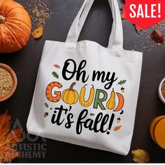 a white tote bag that says oh my gourd it's fall