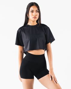 HIGHLIGHTS. Short sleeve Breathable mesh Layering FIT SUGGESTION. This item runs true to Alphalete's oversized fit... Laura is 5’6”/168cm, wearing a size XS. with 28"/71cm bust. MATERIALS AND WASHING DIRECTIONS. 65% Nylon, 35% Spandex. We recommend washing inside-out on a cold setting. Hang to dry DESCRIPTION This light weight mesh makes for the perfect summer layering piece. Wear it over any of your favorite Alphalete bras for a stylish layer that will help keep you cool in the summer heat. | A Black Athleisure Cropped T-shirt For Workout, Mesh Sleeve Tops For Sports, Black Relaxed Fit Cropped T-shirt Athleisure, Casual Top With Short Mesh Sleeves, Athleisure Tops With Mesh Back And Crew Neck, Athleisure Crew Neck Top With Mesh Back, Athleisure Stretch Cropped T-shirt For Streetwear, Casual Mesh Short Sleeve Crop Top, Sports Mesh Top With Mesh Sleeves