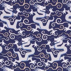 a blue and white dragon pattern on fabric