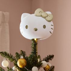 a hello kitty lamp on top of a christmas tree