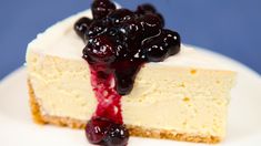 a piece of cheesecake with blueberries on top