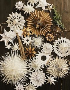 some white and gold paper flowers on a table