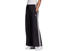 adidas Originals Relaxed Pants - Women's Casual Pants : Black : The primary materials that compose this product contain a minimum of 20 percent recycled content. These adidas Originals Relaxed Pants have a vintage look and modern, responsible design that are perfect for any street ready look. These track pants have a relaxed and loose feel that provides exceptional comfort. The elastic waistband has an external, adjustable drawcord to help you get a secure fit every time. Zip close side pockets Adidas Sweatpants For Spring Streetwear, Relaxed Fit Streetwear Bottoms With Three Stripes, Relaxed Fit Bottoms With Three Stripes For Streetwear, Adidas Relaxed Fit Pants With Three Stripes, Adidas Relaxed Fit Sweatpants With Three Stripes, Spring Streetwear Joggers With Three Stripes Branding, Adidas Sporty Wide Leg Sweatpants, Athleisure Streetwear Bottoms With Contrast Stripes, Athleisure Bottoms With Contrast Stripes For Streetwear