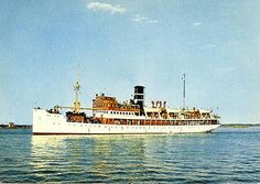 a large white boat floating on top of a body of water