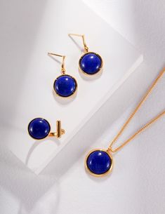 Luxurious Simplicity Shines in our Gold Necklace with a Lapis Lazuli Hemisphere With its blue lapis lazuli hemisphere pendant and gold chain necklace, Señorita J makes a statement of heavenly beauty and modern mystery. An immense, beautiful charm with a round gold case that beautifully bulges out into a Blue Lapis Lazuli hemisphere is the focal point of this beautiful necklace. The bright blue colour of the lapis lazuli stands out beautifully against the shining gold, making a bold and classy ef Royal Blue Lapis Lazuli Jewelry, Royal Blue Round Lapis Lazuli Jewelry, Royal Blue Lapis Lazuli Round Jewelry, Gold Lapis Lazuli Cabochon Jewelry, Gold Lapis Lazuli Jewelry With Cabochon, Lapis Lazuli Earrings, Lapis Lazuli Necklace, Lapis Lazuli Ring, Blue Lapis Lazuli