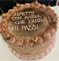 a cake with writing on it sitting on a table