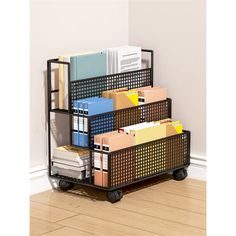 a stack of file boxes sitting on top of a wooden floor