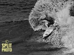 a man riding a wave on top of a surfboard