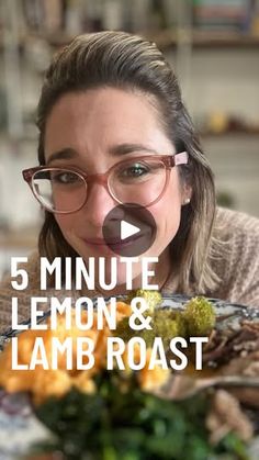 a woman with glasses is looking at the camera while eating lemons and lamb roast