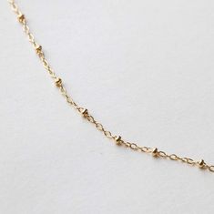 Satellite Chain - OXB Studio Elegant Jewelry With Rolo Chain And Round Beads, Dainty Everyday Satellite Chain Necklace, Dainty Yellow Gold Station Necklace With Satellite Chain, Minimalist Satellite Chain Necklace For Layering, Modern Jewelry With Satellite Chain For Layering, Minimalist Yellow Gold Ball Chain Necklace, Minimalist Yellow Gold Chain Necklace With Ball Chain, Classic Beaded Chain Necklace As Gift, Dainty Satellite Chain Link Jewelry