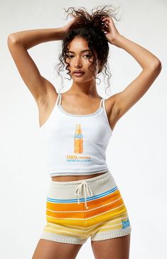 PacSun exclusive! Add a retro flair to your look with the Fanta x PacSun Double Layered Tank Top. Crafted from ribbed fabric, this tank features a vintage-inspired Fanta graphic on the front for a hint of nostalgia. With its double-layered design and cropped fit, it's perfect for your next warm-weather look.Double-layered tank topThin fixed strapsScoop necklineFanta graphicCropped lengthFittedRibbed fabric95% cotton, 5% spandexMachine washableModel is wearing a size smallModel measurements: 5’6” height, 30” bust, 25.5” waist, 36.5” hip Fanta Womens x PacSun Double Layered Tank Top - White size XS Double Layer Tank Top, Layered Tank, Layered Tank Top, Mid Rise Shorts, Layering Tanks, Summer Solstice, Top Graphic Tees, Cozy Knit, Indie Brands