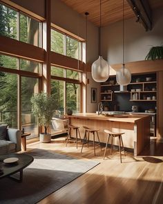 a living room filled with furniture and lots of windows next to a wooden flooring area