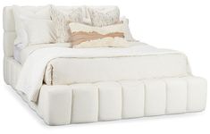 a bed with white sheets and pillows on it's headboard, in front of a white background