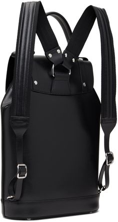 Buffed leather backpack in black. · Padded carry handle · Adjustable padded shoulder straps · Logo hardware and D-rings at face · Magnetic press-stud flap · Drawstring closure · Zip pocket at interior · Fully lined · H14.5 x W10 x D4.25 Supplier color: Black Modern Backpack With Palladium Hardware For Daily Use, Leather Backpack With Gunmetal Hardware, Leather Backpack With Silver-tone Hardware For Travel, Leather Travel Backpack With Silver-tone Hardware, Modern Travel Backpack With Silver-tone Hardware, Luxury Leather Backpack With Silver-tone Hardware, Leather Backpack With Palladium Hardware For Everyday Use, Black Leather Backpack With Gunmetal Hardware, Luxury Travel Backpack With Silver-tone Hardware