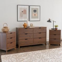 a room with two wooden dressers and a rug on the floor in front of it