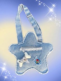 a handbag made out of jeans with patches on it