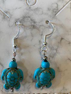 Cute turquoise turtle earrings on sterling ear wires Adjustable Turquoise Earrings With Ear Wire, Turquoise Adjustable Drop Earrings, Turquoise Pierced Earrings, Turquoise Sterling Silver Earrings For Beach, Hypoallergenic Turquoise Dangle Jewelry, Turtle Earrings, Ear Wires, Jewelry Earrings Dangle, Dangle Drop Earrings