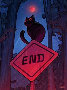 a black cat sitting on top of a red end sign