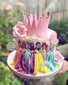 there is a cake that has princesses on it