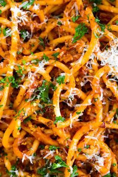 pasta with meat and parmesan cheese on top