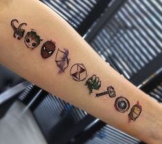 a person with a tattoo on their arm that has the names of different movies and characters