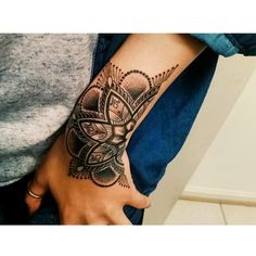 a woman's arm with a tattoo on it and a butterfly in the middle