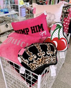 a shopping cart filled with pillows and other items