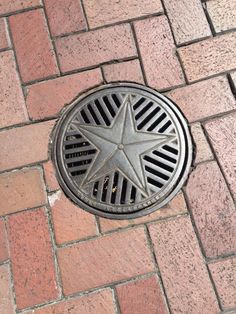 a manhole cover with a star on it