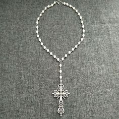 Pearl Necklace-White Pearl Cross Rosary Handmade Beaded Pearl Chain Beads Necklace With Cross Pendant Gothic Necklace Victorian Cross Jewelry Shape\pattern: Cross Occasion: Party Necklace Type: Chains Necklaces Metals Type: Zinc alloy Material: Metal Item Type: Necklaces Gender: Women Model Number:3256804334290530 Handmade Material Science; Metal close; Lobster clasp The necklace is about 46 cm long White Cross Necklace For Party, White Metal Pearl Necklace With Round Beads, White Pearl Necklace With Round Metal Beads, White Metal Beaded Necklaces With Beaded Chain, White Beaded Metal Necklace, Handmade Metal White Pearl Necklace, Handmade White Metal Pearl Necklace, White Beaded Pearl Necklace, White Metal Beaded Necklaces With Round Beads