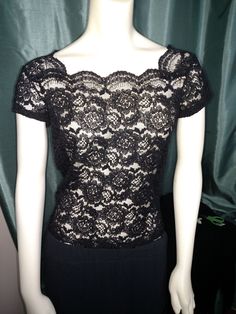 "VINTAGE 90,s BLACK COCTAIL PARTY EVENING GLAMOUR STRECH LACE BLOUSE TOP. Beautiful black lace elegant top. Finish around the neck showed beauty of lace. This top looks good with jacket or you can used for evening glamour. Excellent Condition. Size S ( Please check the measurement;) Sholder: 14\" or 35.5 cm Bust 17\" or 43 cm Hip: 16\" or 40.5 cm Lenght: 19\" or 48 cm Thank you for visiting my store. You can also visit my \" MargaretJewelryPlus \"" Fitted Lace Party Top, Stretch Lace Top For Party, Party Lace Fitted Top, Glamorous Fitted Short Sleeve Tops, Evening Stretch Lace Top, Elegant Evening Lace Top With Short Sleeves, Elegant Short Sleeve Lace Top For Evening, Elegant Fitted Lace Top With Short Sleeves, Fitted Short Sleeve Lace Top For Night Out