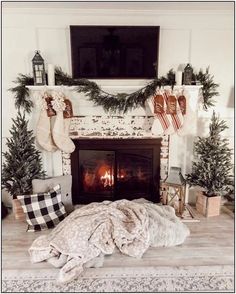 a living room with a fire place and christmas decorations