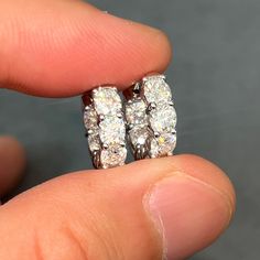 Stunning 4.20 carat hoops made with 4mm prong set cushion cut stones. Moissanite offers timeless beauty and exceptional value. This is the best compromise between cheap fakes (CZ, crystal, rhinestone) and extremely expensive diamond studs. Natural diamond equivalent hoops cost $2000+. Get the same look at a reasonable price. Order yours today! -VVS1 Clarity D color GRA certified Moissanite Stones -Hearts and Arrows Pattern Ideal Cut, Excellent Rating.  -More Fire and Brilliance than Cheap Priced Moissanite online -9.25 Hardness Rating (will not dull/scratch easily). Diamonds are perfect 10, most fake stones are 3-4.  -Choose Sterling Silver (Rhodium or Gold Plated) or solid 14K Gold -Passes many Thermal Diamond Testers -Comes with inner/outer box with GRA certificate Earrings Huggies, Fake Stone, Expensive Diamond, Oversized Earrings, Arrow Pattern, Stone Heart, Jewelry Earrings Hoops, Cushion Cut, Diamond Studs