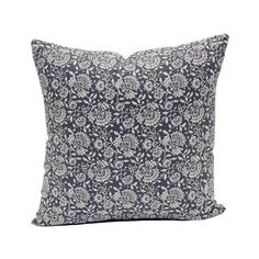 a black and white floral pillow on a white background