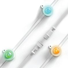 three electric toothbrushes with different colors and sizes on them, lined up against a white background