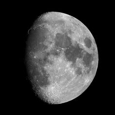 the full moon is shown in black and white