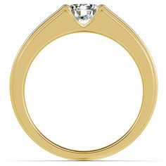 a yellow gold engagement ring with a single diamond in the center, on a white background