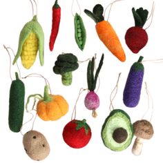 an assortment of vegetables hanging from strings