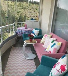 a balcony with couches, tables and chairs on it