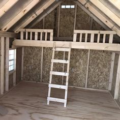 a ladder is in the middle of an attic