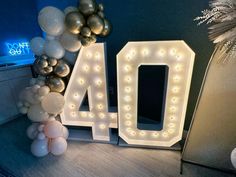 balloons are arranged around the letters that spell out 40