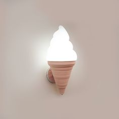 an ice cream cone shaped light on the wall next to a gray wall with a white background