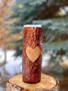 a tree stump with a heart carved on it