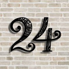 the number twenty four is shown on a brick wall