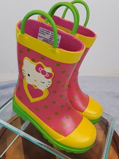 Hello Kitty Pink Green Yellow Rubber Easy Pull On Rain Boots Girls Size 7/8 DESCRIPTION * Slip-on * 2 Handles to make it easy for the little one to pull on and off * Round toe * Non-marking rubber sole * Imported MEASUREMENTS * Size 7/8 * 7" Height CONDITION * Very good condition. Please refer to photos for specific condition of item. "Feel free to email questions if you need more info."  Stock #S16 ljmforu Hello Kitty Pink, Pink Green Yellow, Girls Boots, Green Yellow, Rubber Rain Boots, Little One, Rain Boots, Pink And Green, Rubber Sole