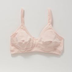 A more supportive style for larger cup sizes. Horizontal seams across the cups, fabric front straps and other thoughtful details shape and support—without sacrificing style or comfort. Designed with measurements from real women, not mannequins. Supports A-D cups. Slip-on style, no back closure. Adjustable straps with rose gold hardware. Double-layered, organic cotton with a covered elastic band. 94% organic cotton, 6% spandex. Cut and sewn in the U.S. Machine wash and dry. Size Guide Fitted Full Coverage Sports Bra With Built-in Cups, Supportive Full Coverage Bra With Built-in Cups, Supportive Nursing Bra For Everyday Use, Everyday Fitted Seamless Nursing Bra, Everyday Nursing Bra With Removable Pads, Stretch Nursing Bra For Everyday, Everyday Fitted Bra With Medium Bust Support, Fitted Nursing Bra For Everyday, Everyday Fitted Nursing Bra