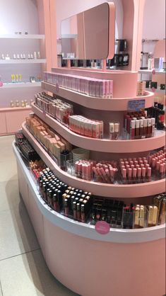 there is a display in the store with many different items on it and one shelf has lipstick